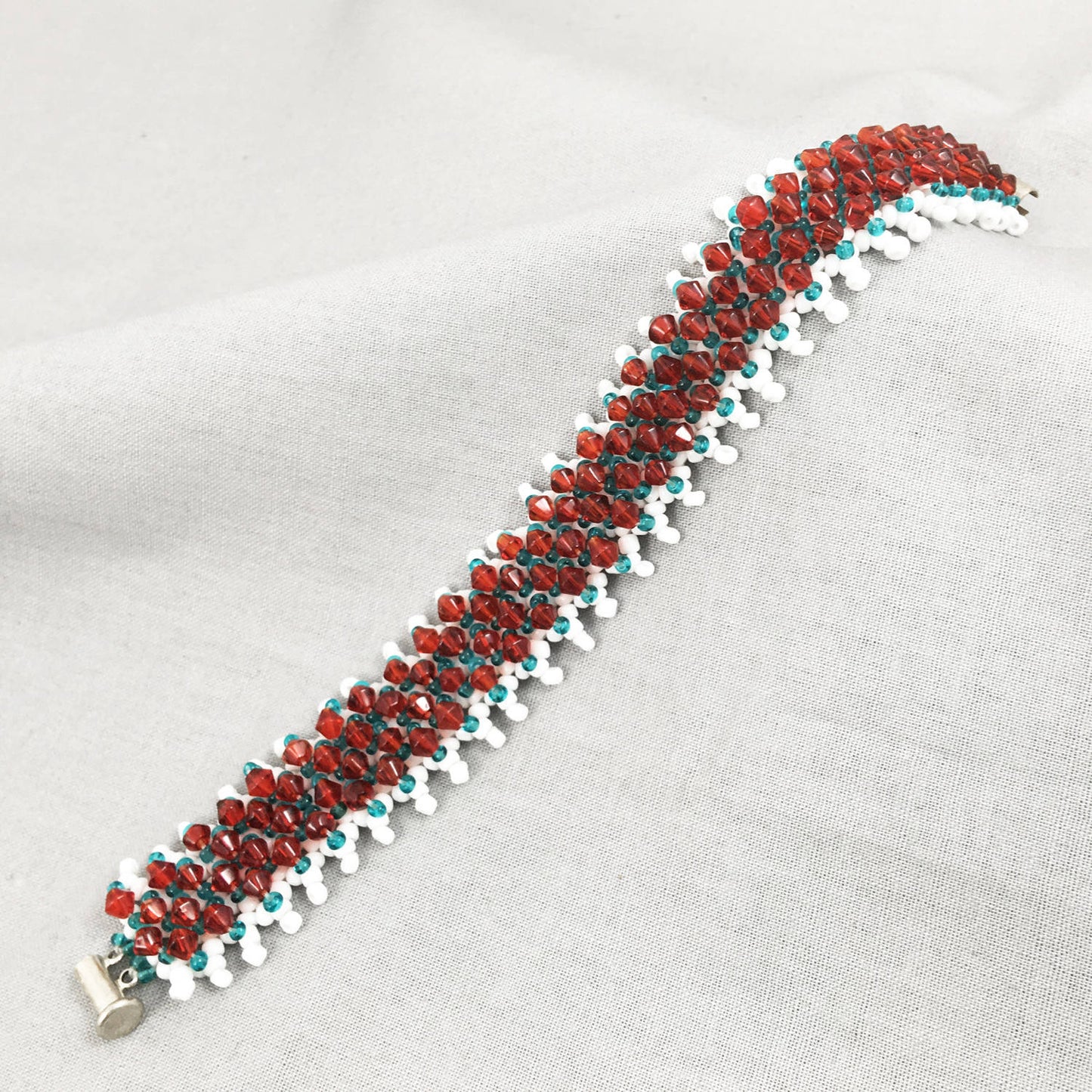 White and Turquoise Beaded Bracelet with Red Crystals