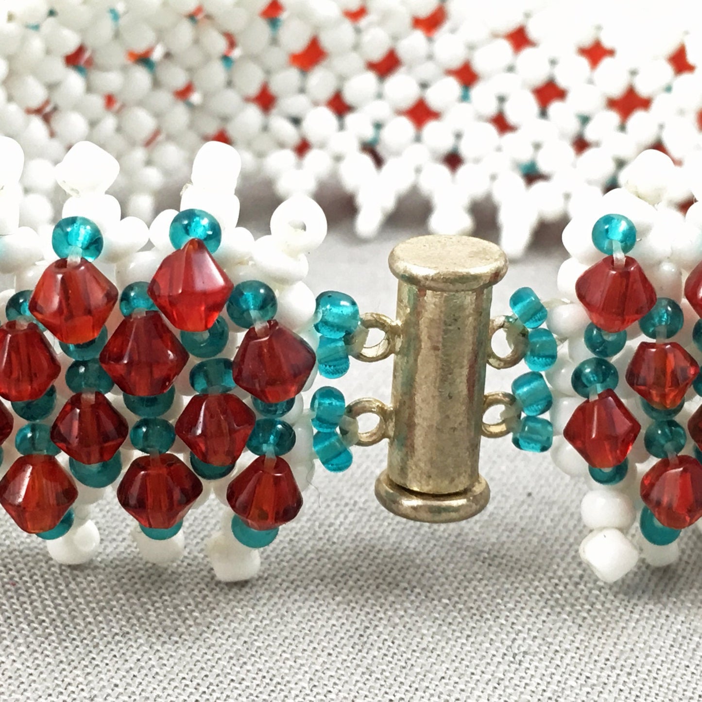 White and Turquoise Beaded Bracelet with Red Crystals