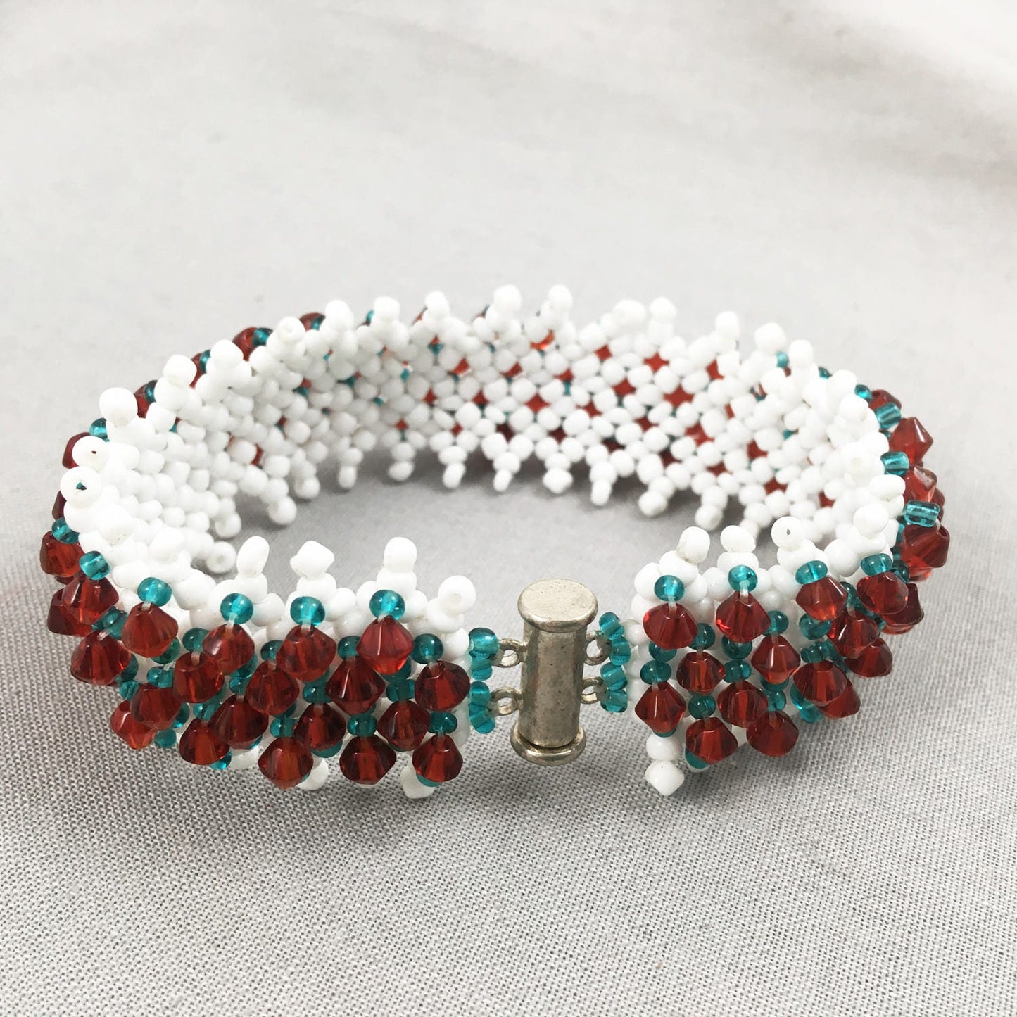 White and Turquoise Beaded Bracelet with Red Crystals