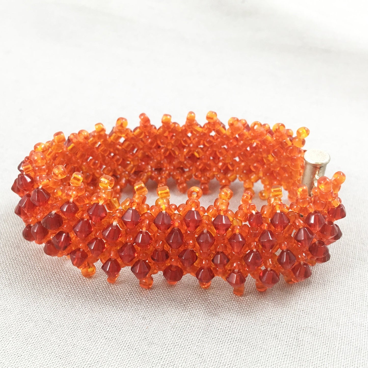 Orange Beaded Bracelet with Red Crystals