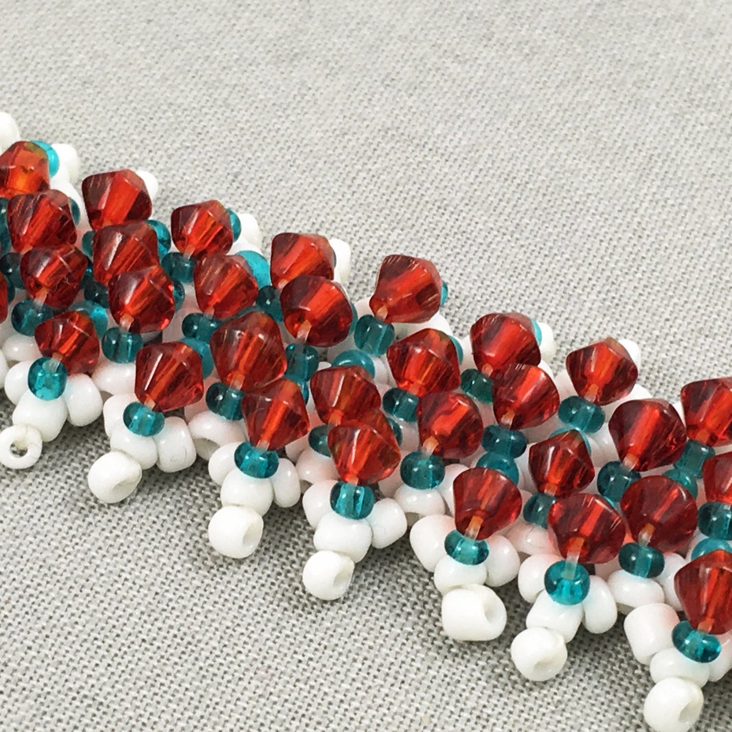 White and Turquoise Beaded Bracelet with Red Crystals