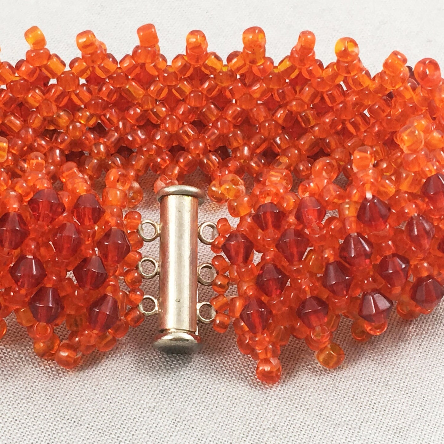 Orange Beaded Bracelet with Red Crystals