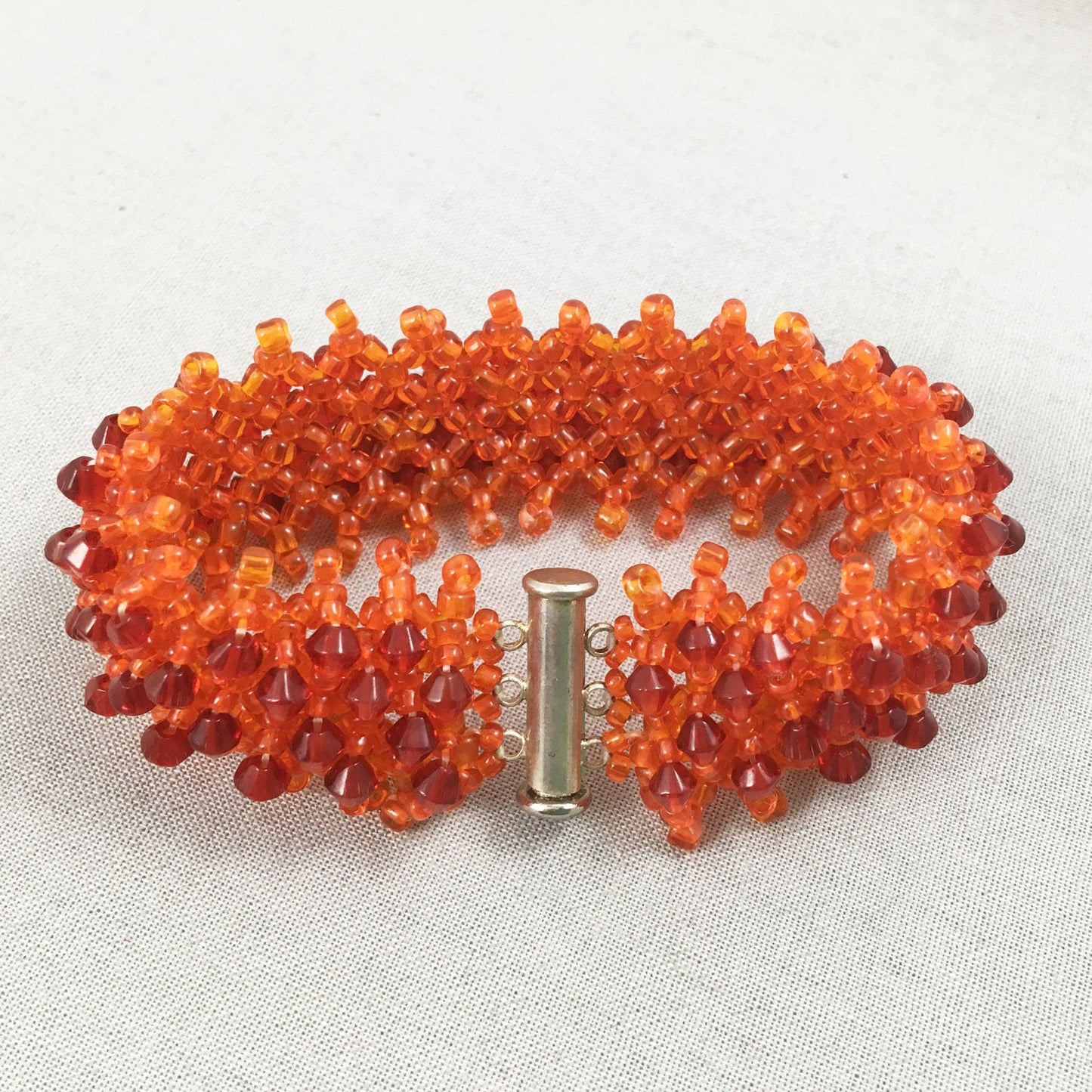 Orange Beaded Bracelet with Red Crystals